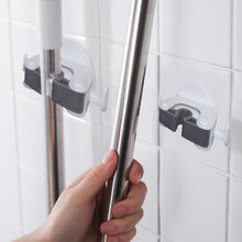 Mop and broom organizer with wall-mount design.