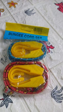 Close-up of strong plastic J shape hooks attached to bungee cord.
